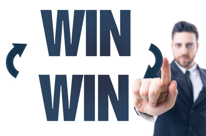Business man pointing the text: Win Win